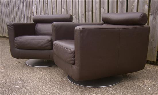 A pair of Natuzzi leather swivel armchairs W.77cm